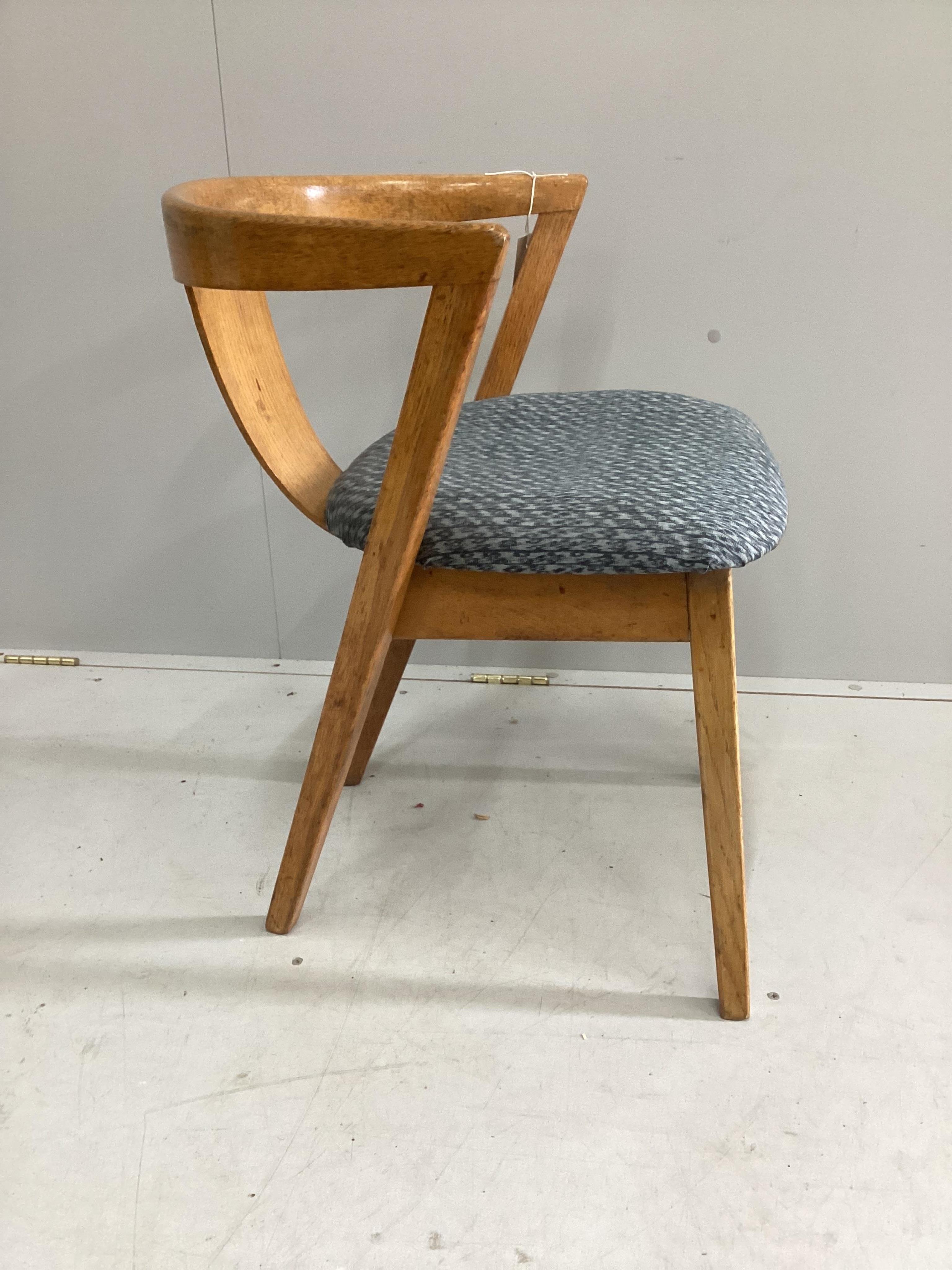 A pair of mid century Greaves & Thomas ‘Put U Up’ oak chairs, width 54cm, depth 48cm, height 48cm. Condition - fair